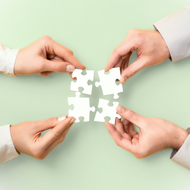 image of puzzle pieces coming together
